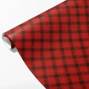 Roll of red and black lumberjack check wrapping paper with fine gold pinlines, partly unrolled on white