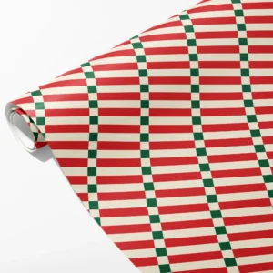 Roll of red and cream striped wrapping paper crossed by narrow green and cream check columns, partly unrolled on white