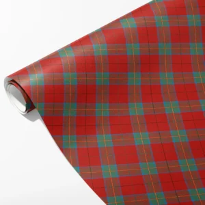 Roll of red wrapping paper with teal windowpane bands and fine gold pinlines, partly unrolled on white
