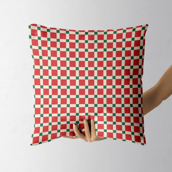 Hand holding the retro red tile throw pillow