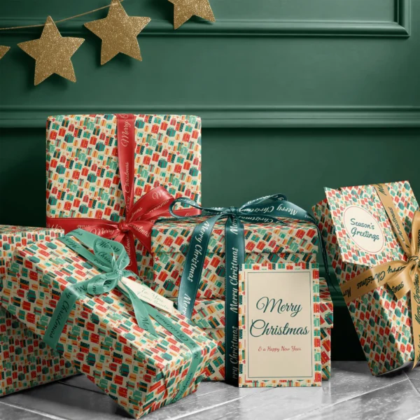 Stack of presents in retro present paper with ribbons and a Merry Christmas card by a dark green wall