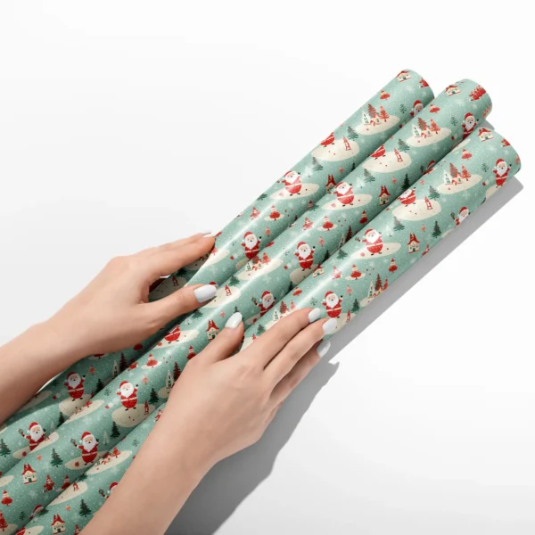Hands smoothing three rolls of mint retro Santa wrapping paper on a white table
