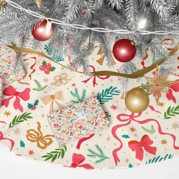 Close-up of hot-pink, cherry and mustard dotted bows with pine and fern sprigs