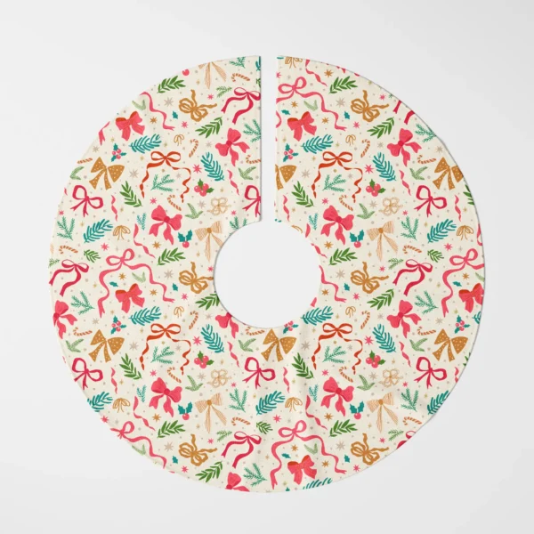 Ribbon and greenery tree skirt laid flat, top view of pink, red and gold bows on cream