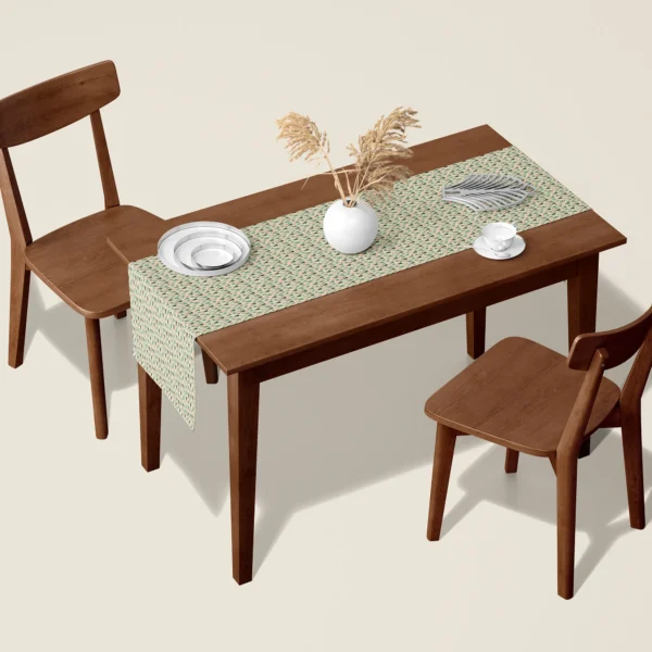 Sage tree Christmas table runner on a walnut dining table with two wooden chairs
