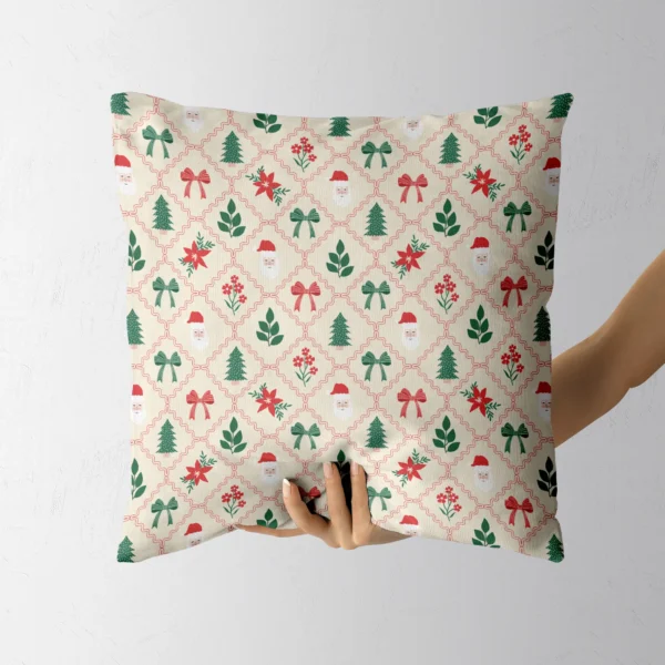 A hand holding the cream Santa and poinsettia lattice cushion