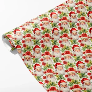 Roll of white wrapping paper with watercolor Santa faces, red poinsettias and green leaves, partly unrolled on white