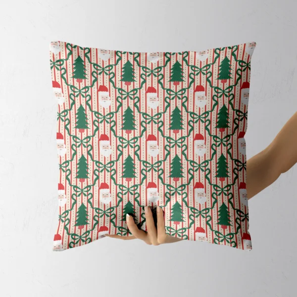 A hand holding the Santa and green ribbon trellis throw pillow