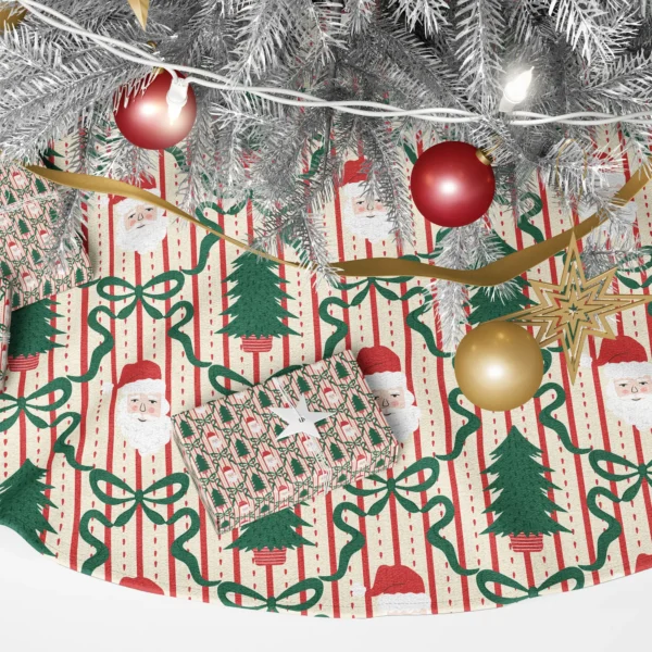 Close-up of a rosy Santa face beside a fir in a striped pot, framed by green bows