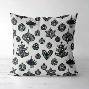 Scandi ornament pillow, black and cream, front facing on white floor