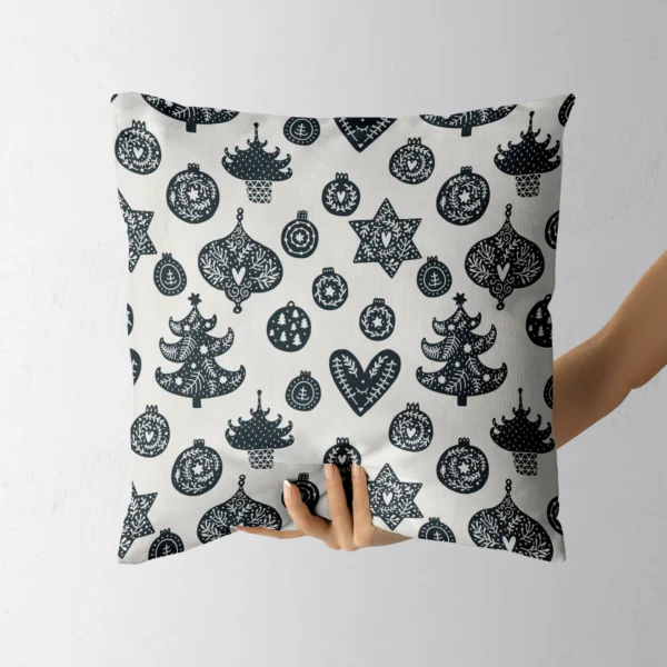 Folk ornament cushion held by a hand