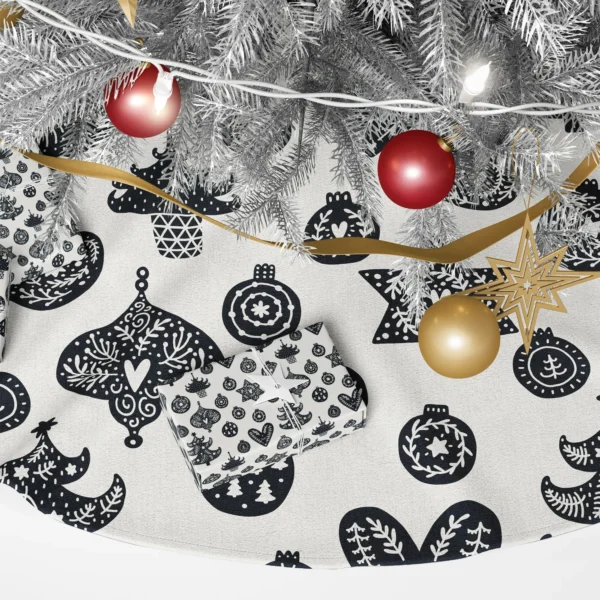 Close-up of black crowned baubles and stars filled with cream sprigs