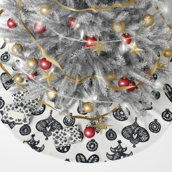 Black and cream folk ornament skirt beneath a lit tree and wrapped gifts