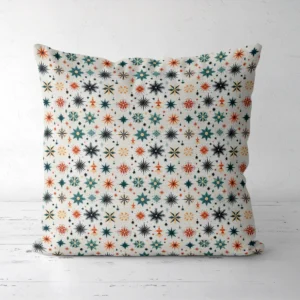 Scandi starburst Christmas pillow, front view, on a white floor