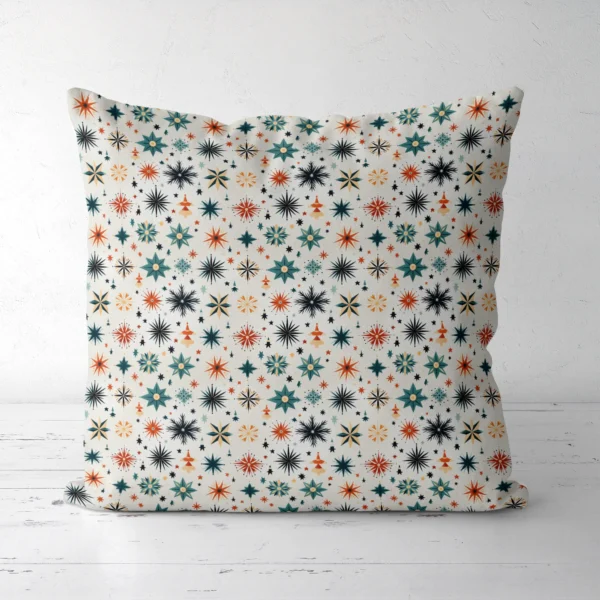Scandi starburst Christmas pillow, front view, on a white floor