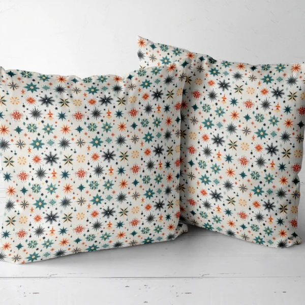 Two Scandi starburst throw pillows next to each other