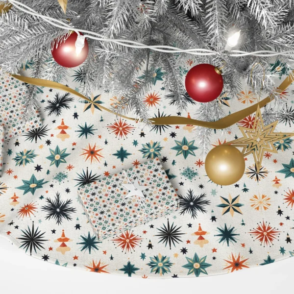Close-up of the print: teal eight-point star, rust burst with golden rays and a sand compass star