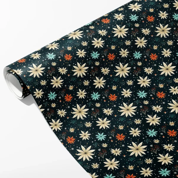Roll of midnight wrapping paper with cream, aqua and orange starflowers and small sprigs, partly unrolled on white