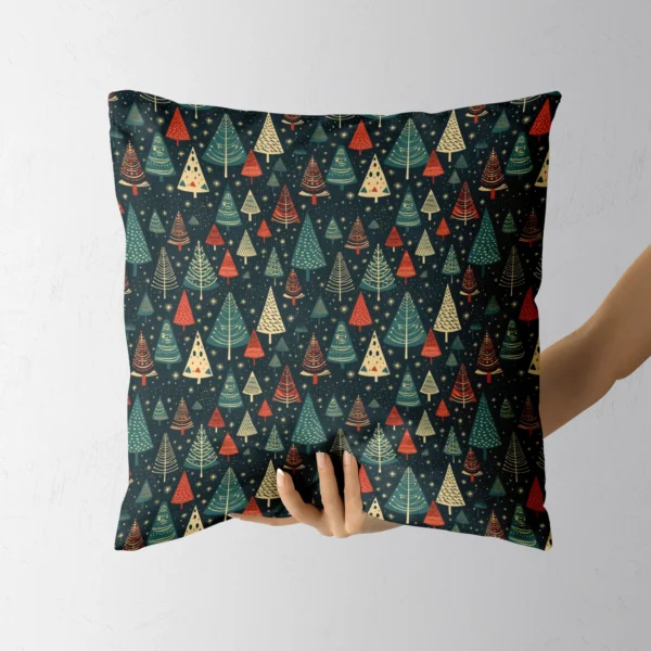 Starry navy Christmas cushion held up by a hand