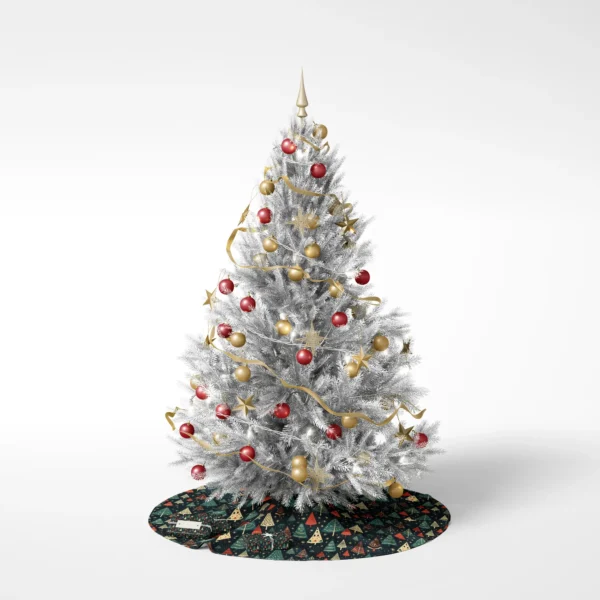 Fully trimmed tree on white placed over the starry navy skirt