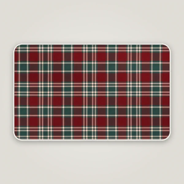 Burgundy and green tartan Christmas bath mat with rounded corners and a bound edge, seen from above