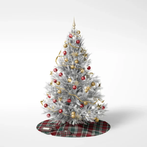 Decorated Christmas tree on a white backdrop standing on the burgundy tartan skirt