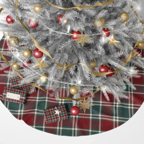 Burgundy plaid tree skirt under a lit Christmas tree with wrapped gifts around it