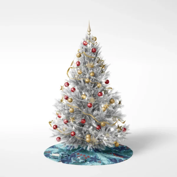 Decorated tree on a white backdrop standing on the teal bullfinch skirt