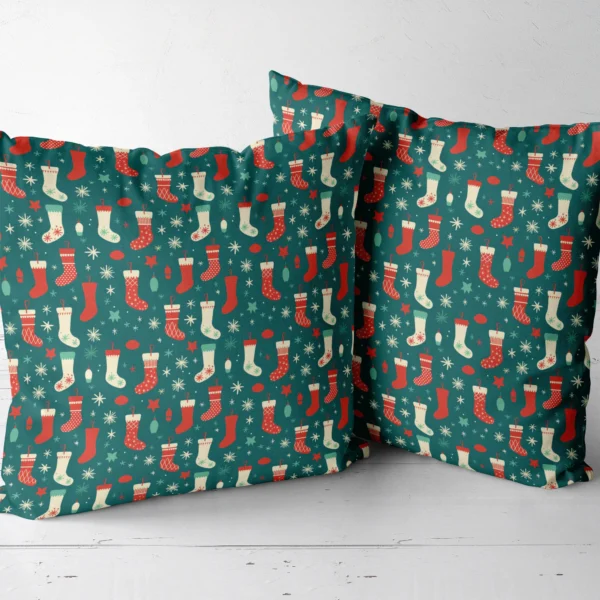 Two teal stocking throw pillows sitting side by side