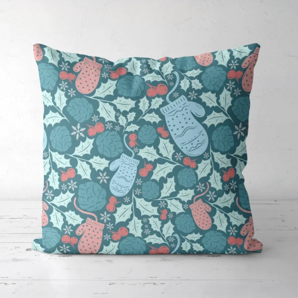 Teal mitten Christmas pillow on a white floor, front facing