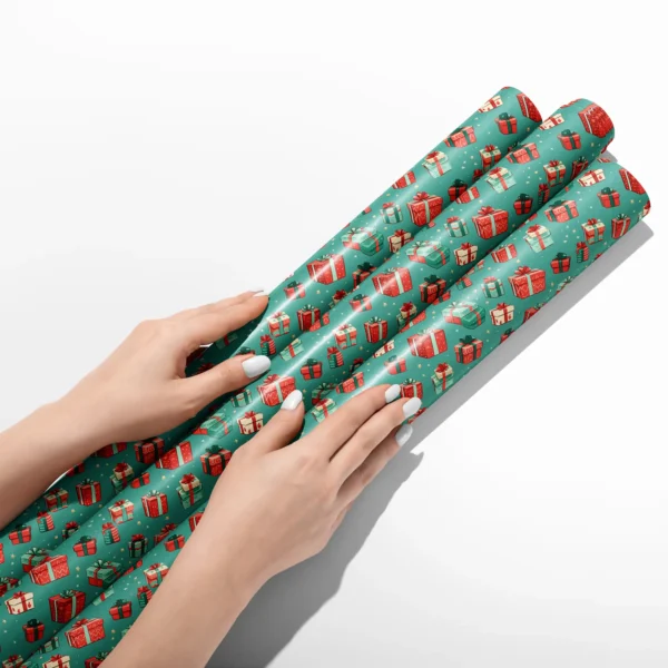 Hands smoothing three rolls of teal gift box wrapping paper on a white table