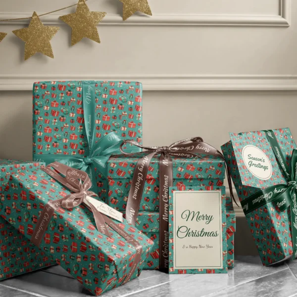 Stack of presents in teal gift box paper with ribbons and a Merry Christmas card by a beige wall