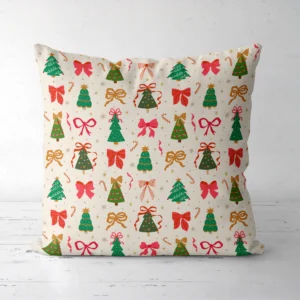 Tree and bow Christmas pillow standing upright on a white floor, front view
