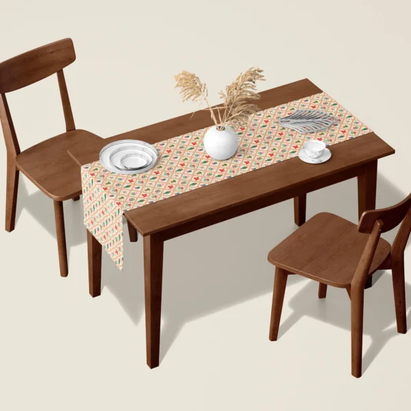 Vintage gold tile Christmas table runner on a walnut dining table with two wooden chairs