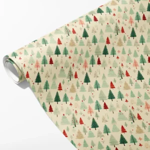 Roll of cream wrapping paper with a soft forest of green, mint, red and pink Christmas trees, partly unrolled on white