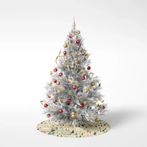 White-background shot of a decorated tree resting on the cream forest skirt