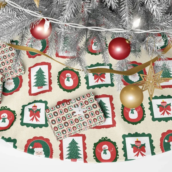 Close-up of a Santa portrait, a snowman and a holly candle in scalloped frames