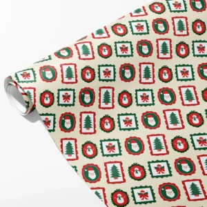 Roll of cream wrapping paper with red and green frames holding Santa, snowmen, trees and candles, partly unrolled on white