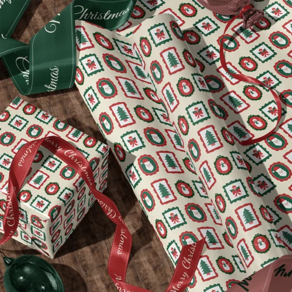 Rolls of vintage frames gift wrap and a wrapped box with satin ribbons on a wooden floor
