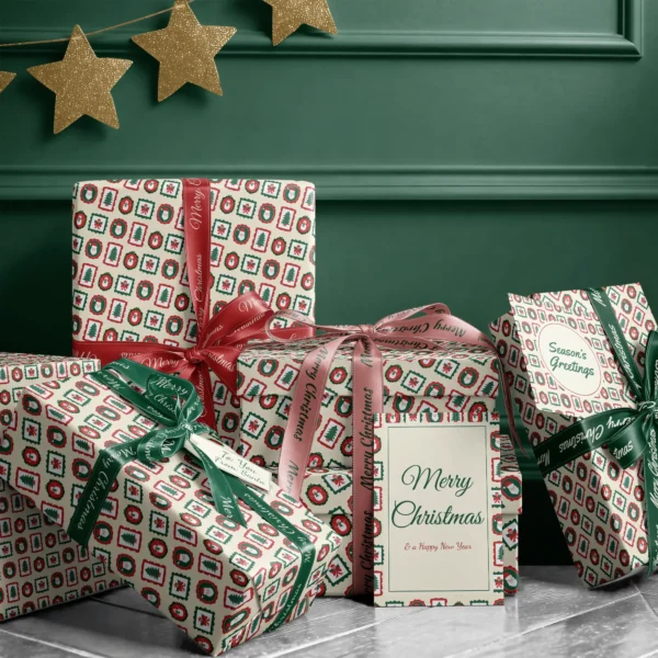 Stack of presents in vintage frames paper with ribbons and a Merry Christmas card by a dark green wall