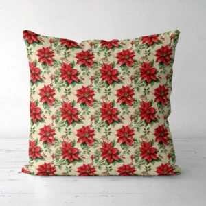 Vintage poinsettia Christmas pillow, front view, on a white floor