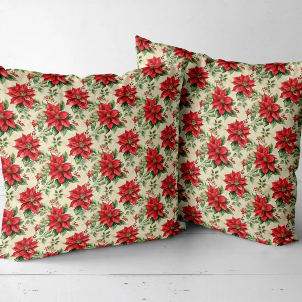 Two vintage poinsettia throw pillows next to each other