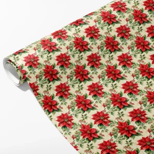 Roll of cream wrapping paper with large red poinsettias, holly leaves and red berries, partly unrolled on white