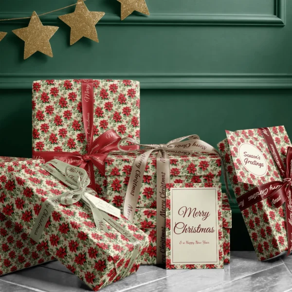 Stack of presents in vintage poinsettia paper with ribbons and a Merry Christmas card by a dark green wall