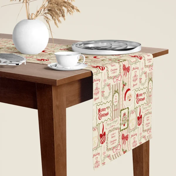 Vintage Santa card Christmas table runner hanging over the end of a walnut dining table, close-up