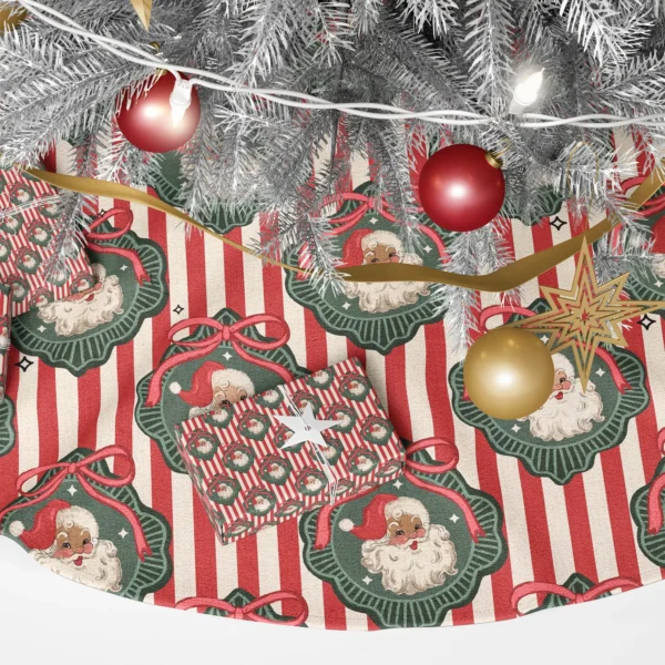 Close-up of a Santa portrait in a green scalloped frame with a bow on red and cream stripes