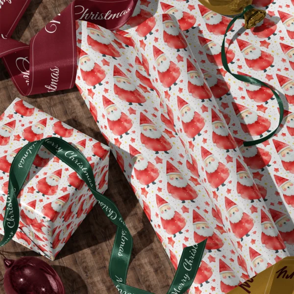 A sheet of red watercolor Santa gift wrap and a wrapped box with satin ribbons on a wooden floor
