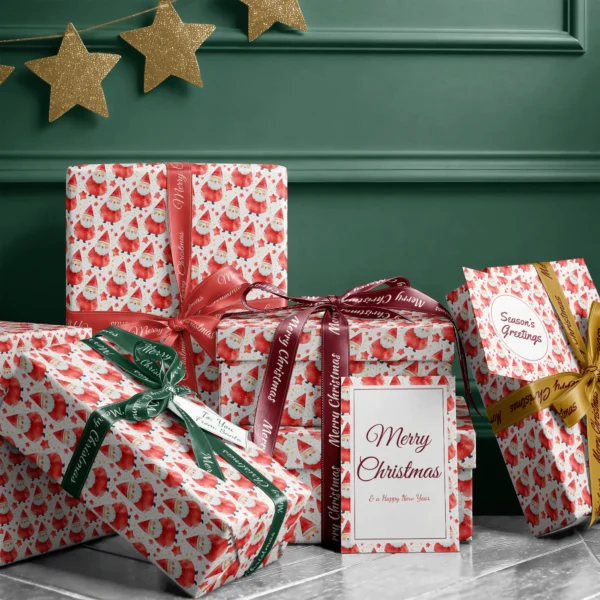 Stack of presents in red watercolor Santa paper with ribbons and a Merry Christmas card by a dark green wall