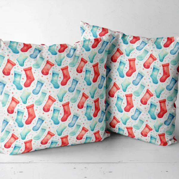 Two watercolor stocking throw pillows next to each other