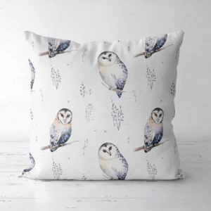 White watercolor owl pillow standing on a white floor, front view